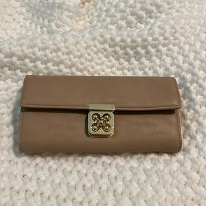 Beige and gold clutch.